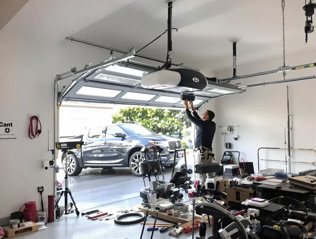 Gastonia Garage Door Repair specialist installing smart garage door opener system in Gastonia home