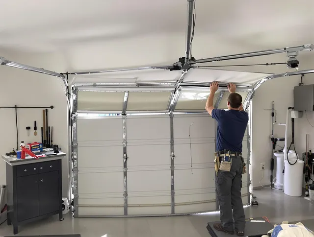 Gastonia Garage Door Repair specialist performing precise section replacement on Gastonia garage door